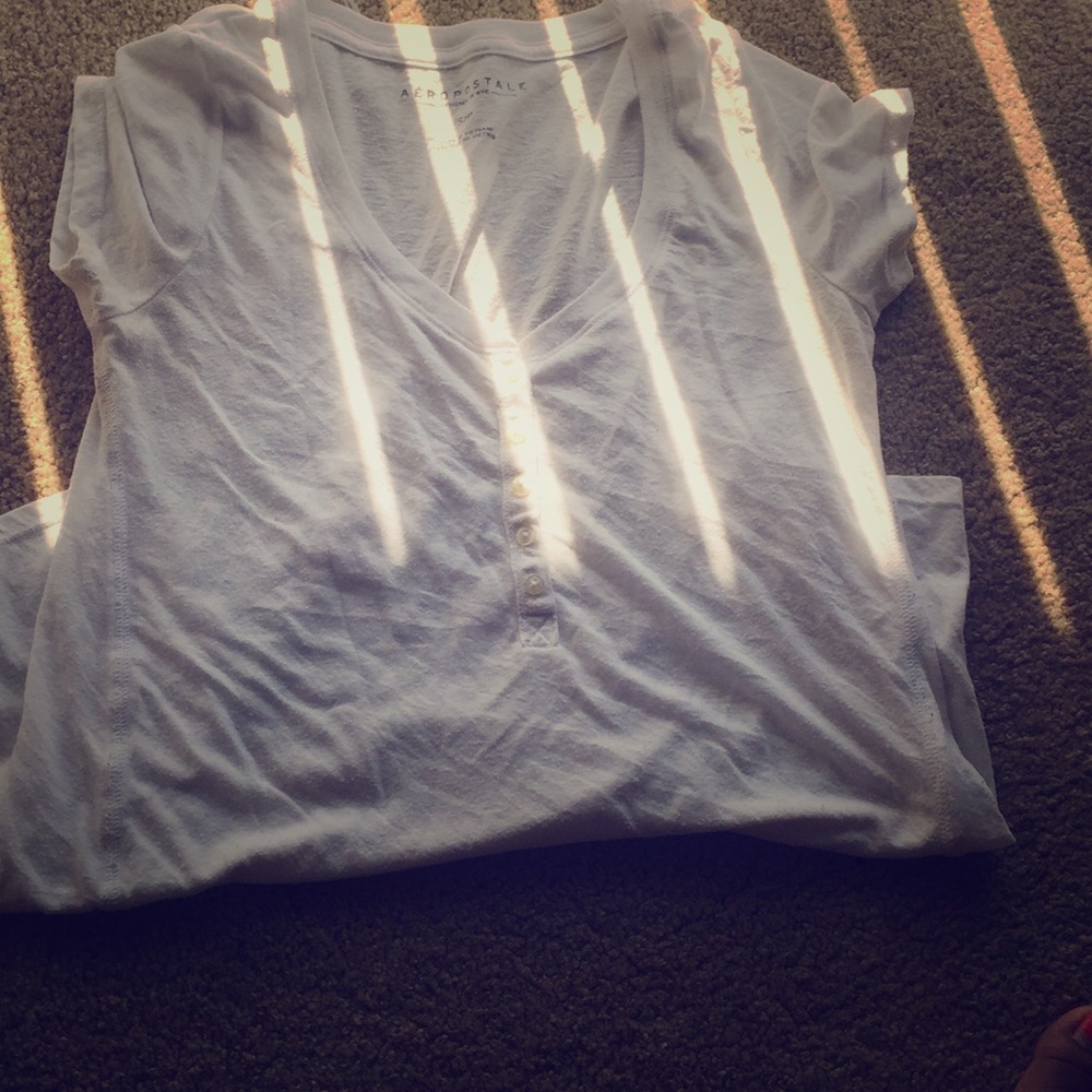 white button up shirt .
